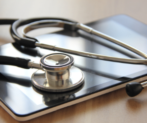 What's the difference between monitoring and auditing a healthcare compliance program?